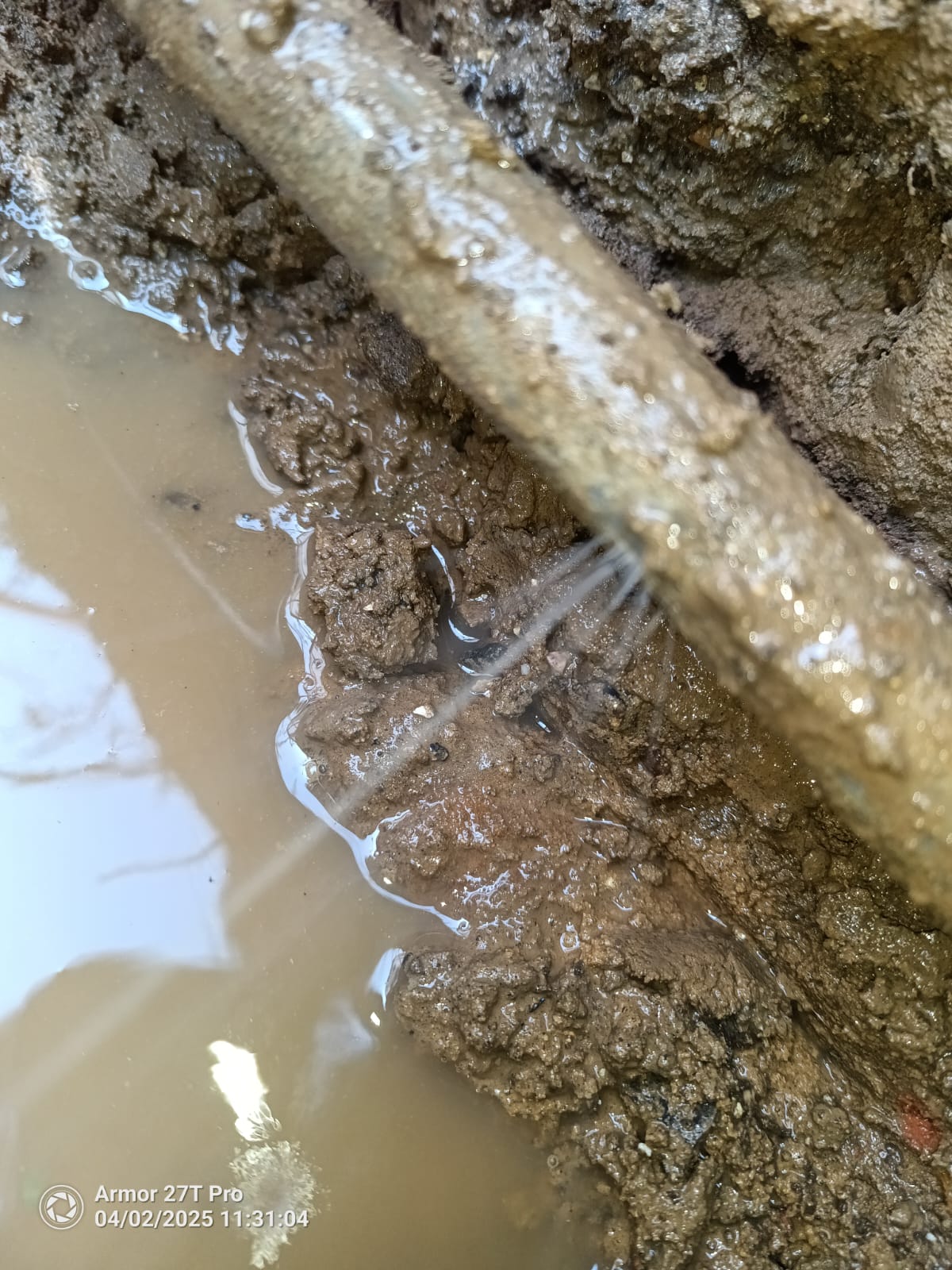 Water pipe repair showing damaged pipe section